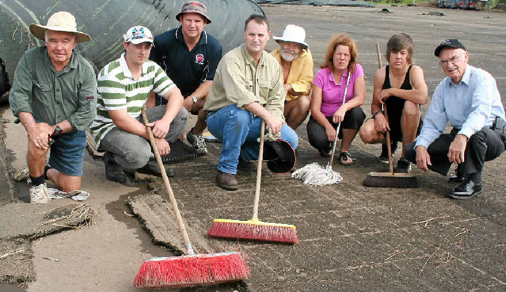 Above: Volunteers clean up the hockey complex after a flood.